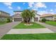 Beautiful two-story home with a well-manicured lawn and a symmetrical three-car garage at 2818 Starwood Ct, Lakewood Ranch, FL 34211