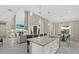 Open-concept kitchen flows to the living area, featuring a large island and views of the fireplace at 2818 Starwood Ct, Lakewood Ranch, FL 34211