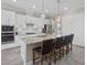 Well-appointed kitchen featuring granite countertops, stainless steel appliances, and a breakfast bar at 2818 Starwood Ct, Lakewood Ranch, FL 34211