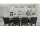 Spacious kitchen featuring a large island, pendant lighting, and stainless steel appliances for modern living at 2818 Starwood Ct, Lakewood Ranch, FL 34211