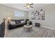 Comfortable upstairs seating area with sofa, ottoman, area rug and wall art at 2818 Starwood Ct, Lakewood Ranch, FL 34211