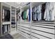 Organized walk-in closet with ample shelving, hanging racks, and drawer storage at 2818 Starwood Ct, Lakewood Ranch, FL 34211