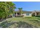 House with lush landscaping on a beautiful lawn at 3018 Oriole Dr, Sarasota, FL 34243