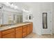 Bathroom features a double vanity, granite countertop, and a shower at 3018 Oriole Dr, Sarasota, FL 34243