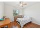 Bright bedroom with a ceiling fan, hardwood floors, and natural light at 3018 Oriole Dr, Sarasota, FL 34243