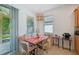 Cozy breakfast nook with a built-in bench, comfortable seating, and natural light at 3018 Oriole Dr, Sarasota, FL 34243