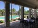 Enjoy the view of the sparkling community pool from the shaded outdoor patio at 3018 Oriole Dr, Sarasota, FL 34243