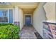Inviting front entryway featuring stone accents, brick walkway, and a stylish, glass-paneled front door at 3018 Oriole Dr, Sarasota, FL 34243