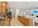 Well-appointed kitchen with granite countertops, stainless steel appliances, and an oversized center island at 3018 Oriole Dr, Sarasota, FL 34243