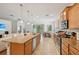 Beautiful kitchen featuring a large island, stainless appliances, and an open layout to living and dining areas at 3018 Oriole Dr, Sarasota, FL 34243
