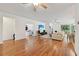 Spacious living room with hardwood floors and natural light, flowing into adjacent rooms for easy living at 3018 Oriole Dr, Sarasota, FL 34243