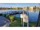 Scenic view of a lake with a pier and waterfront condominium buildings in the background at 3368 Lake Bayshore Dr # 217 Building P, Bradenton, FL 34205