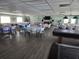 A spacious meeting room is arranged with tables and chairs, decorated for an event or gathering at 3368 Lake Bayshore Dr # 217 Building P, Bradenton, FL 34205