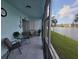Relaxing screened patio with seating and lake views at 3368 Lake Bayshore Dr # 217 Building P, Bradenton, FL 34205