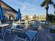 View of a pool deck featuring outdoor furniture, lounge chairs, and a peaceful waterfront view at 3368 Lake Bayshore Dr # 217 Building P, Bradenton, FL 34205