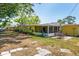 Spacious backyard featuring a charming patio and a screened-in porch, perfect for relaxation at 337 Somerset Ave, Sarasota, FL 34243