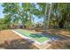 Enjoy outdoor fun with a dedicated shuffleboard court in this home's backyard at 337 Somerset Ave, Sarasota, FL 34243