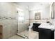Modern bathroom with glass-enclosed shower, double vanity and tiled walls at 337 Somerset Ave, Sarasota, FL 34243