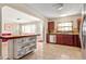 Modern kitchen featuring butcher block island with open shelving and views into the living room at 337 Somerset Ave, Sarasota, FL 34243