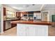 Eat-in kitchen features a butcher block island, stainless appliances, and abundant wood cabinets at 337 Somerset Ave, Sarasota, FL 34243