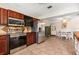 Well-equipped kitchen featuring stainless steel appliances, tiled backsplash, and wood cabinets at 337 Somerset Ave, Sarasota, FL 34243
