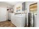Laundry room equipped with washer, dryer, shelving, and wine cooler at 337 Somerset Ave, Sarasota, FL 34243