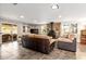 Living room with tile flooring, fireplace, and sliding glass doors to the patio at 337 Somerset Ave, Sarasota, FL 34243