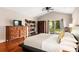 Inviting main bedroom with wood floors, a ceiling fan and a sliding glass door at 337 Somerset Ave, Sarasota, FL 34243