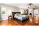 Spacious main bedroom featuring wood floors, a ceiling fan and ensuite bathroom at 337 Somerset Ave, Sarasota, FL 34243