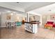 Bright, open floorplan showing kitchen island, dining area, and living space with abundant natural light at 337 Somerset Ave, Sarasota, FL 34243