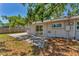 The backyard patio includes a sliding glass door entrance and is partially shaded at 3545 Lalani Blvd, Sarasota, FL 34232