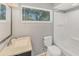 Bright bathroom with a sink vanity, toilet, and shower-tub combo at 3545 Lalani Blvd, Sarasota, FL 34232