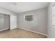 Bedroom with closet, neutral walls, tile flooring, and ample natural light at 3545 Lalani Blvd, Sarasota, FL 34232