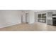 Open floor plan with tile flooring connects living, dining, and kitchen areas at 3545 Lalani Blvd, Sarasota, FL 34232