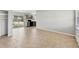 Spacious living area with tile floors flows into the kitchen with backyard views at 3545 Lalani Blvd, Sarasota, FL 34232