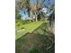 Shady backyard lawn featuring young trees and plenty of foliage at 3612 27Th W Ave, Bradenton, FL 34205