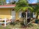 Charming home with mature palm trees and a well-manicured lawn enhancing the curb appeal at 3612 27Th W Ave, Bradenton, FL 34205