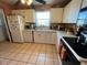 Functional kitchen featuring modern appliances, ample counter space, and ceramic tile flooring at 3612 27Th W Ave, Bradenton, FL 34205