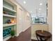 Entryway featuring wood floors, stylish decor, and an open view into the dining and living areas at 3623 Pitch Ln, Sarasota, FL 34232