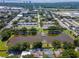 Aerial view of the neighborhood featuring a lake and community amenities at 3810 N Oak Dr # N61, Tampa, FL 33611