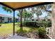 A shaded back patio with green space in a tranquil setting at 3810 N Oak Dr # N61, Tampa, FL 33611