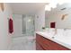 Modern bathroom featuring a single sink vanity and tiled shower with glass doors at 3810 N Oak Dr # N61, Tampa, FL 33611