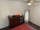 Bedroom with dresser, desk, and full-length mirror; great for flexible living at 3810 N Oak Dr # N61, Tampa, FL 33611