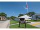 Community clubhouse and office with well-kept landscaping at 3810 N Oak Dr # N61, Tampa, FL 33611