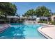 Inviting community pool with ample seating and lush landscaping at 3810 N Oak Dr # N61, Tampa, FL 33611
