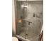 This luxurious shower features tiled walls, a built-in shelf, and a modern glass door at 3810 N Oak Dr # N61, Tampa, FL 33611