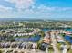 Expansive aerial view of a community with waterfront homes, golf courses, and lush landscaping at 4173 Westbourne Cir, Sarasota, FL 34238
