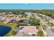 Stunning aerial shot showcasing homes near a waterway, complemented by lush trees and distant ocean views at 4173 Westbourne Cir, Sarasota, FL 34238