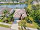 Aerial view of home with lush landscaping and waterfront views, showcasing the neighborhood at 4173 Westbourne Cir, Sarasota, FL 34238