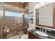 Modern bathroom with a glass-enclosed shower, elegant vanity, and stylish tile work, providing a luxurious feel at 4173 Westbourne Cir, Sarasota, FL 34238